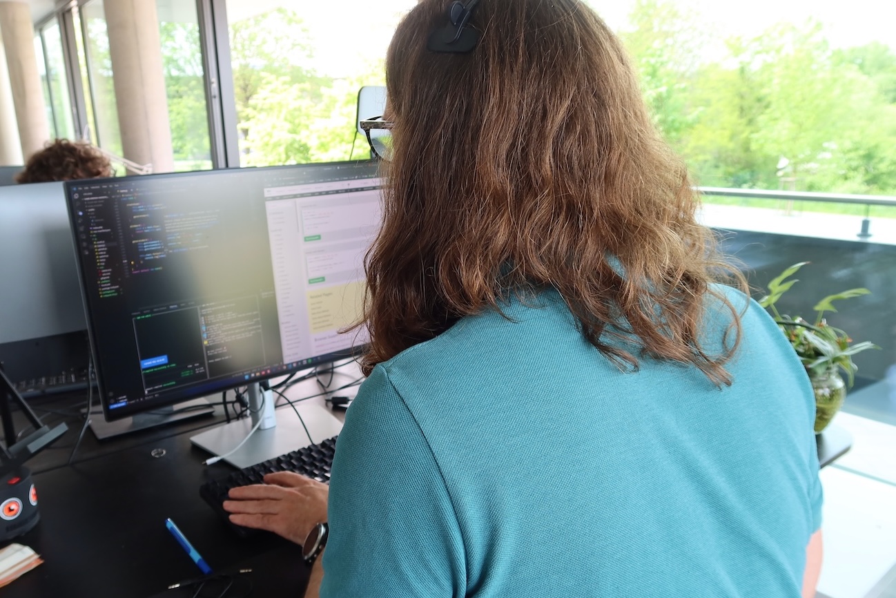 Martin sitting at his computer and programming during the GameJam